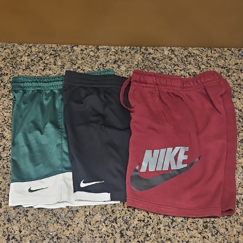 Nike Boys Shorts, Size M. Black has 1 tiny pick on front, 2 on back